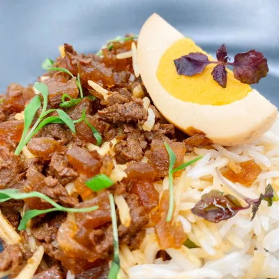 Lu Rou Fan with OsomeFood™ signature CollagenEgg, prepared by AWE.™: Taiwanese-style braised minced meat and braised World’s first plant-based egg served with basmati rice and spring onions. (Photo: Wholesome Savour)