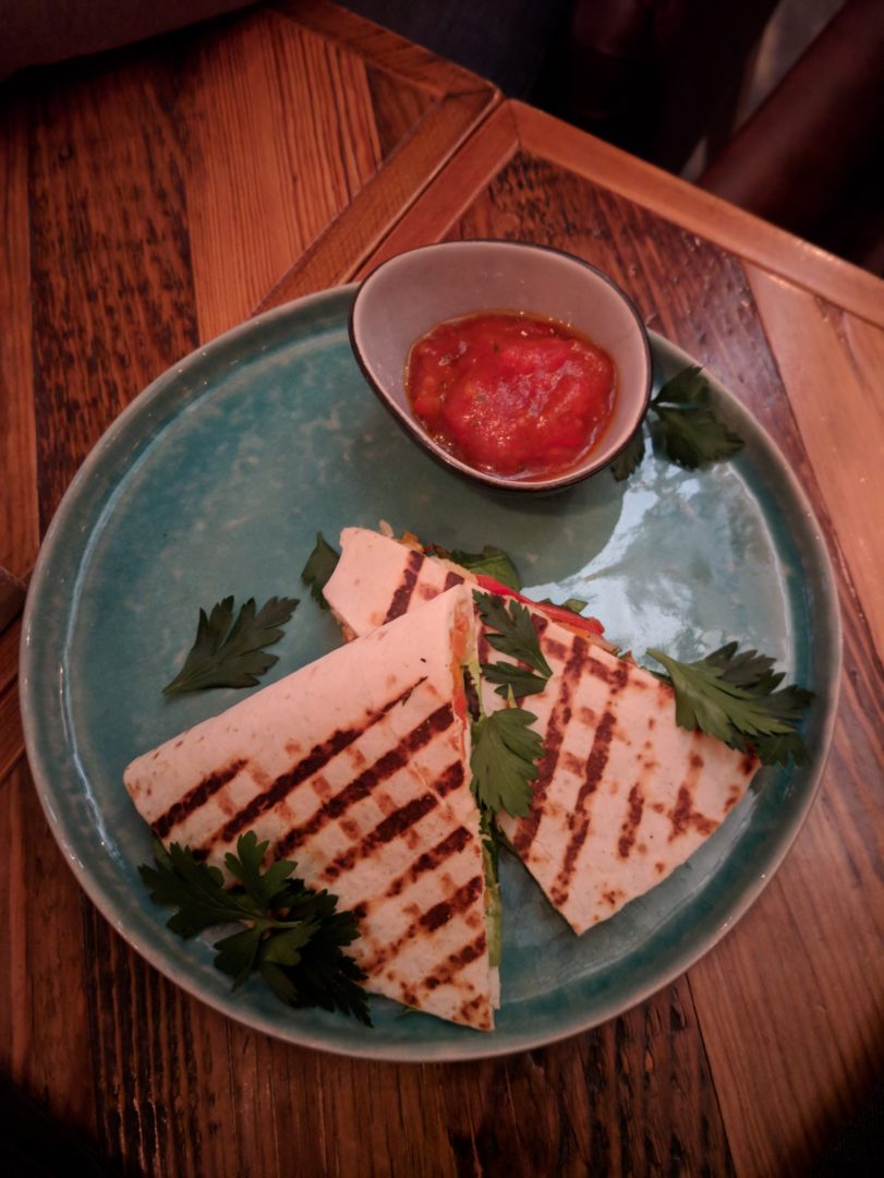 Quesadilla and pumpkin cream soup in the restaurant Mi est in Yekaterinburg