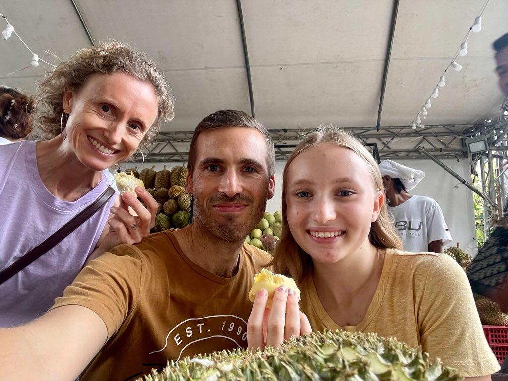 
My absolutely incredible husband and daughter.
This picture is us at the local Durian festival last week! 
Durian is my very favorite food on earth!: Leanne Hill | Raw Vegan