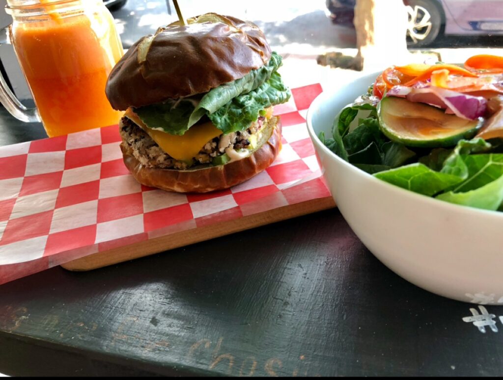 House of Flavor Burger with side salad and fresh fruit/veggie juice: Kylie Jo Donovan