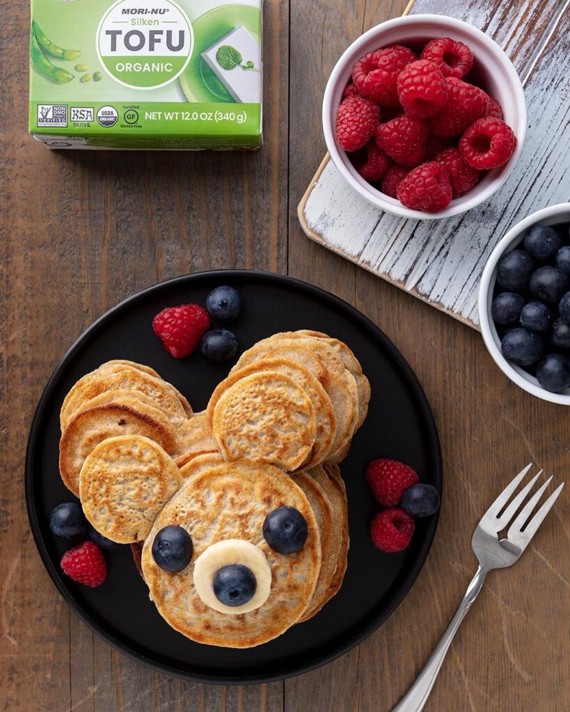 Hobee’s had tofu pancakes on their kids menu, and we always used fruit to make a face on them before bringing them to the table: Robin Means 🎀 Vegan Dollhouse