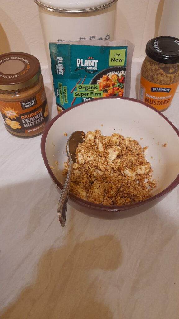 Cooked Tofu , with added Sesame seeds , peanut butter & a little wholegrain mustard , 😋  
Delicious  ! Susan Leeming