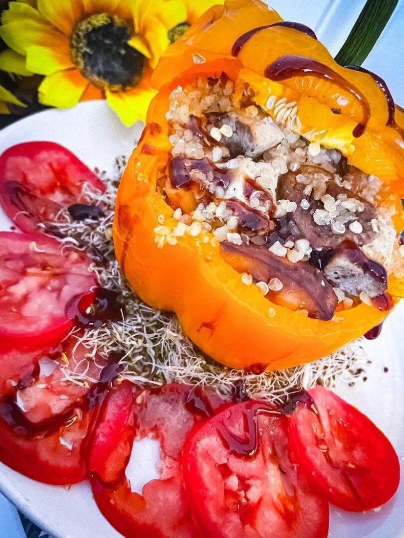 Bulgarwheat Mediterranean veg stuffed pepper with home grown micro greens and beef tomato wit. Balsamic drizzle - Cquinnvegan