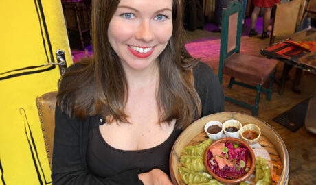 Deanna Troy Travels - Deanna displays vegan dumplings in London, England